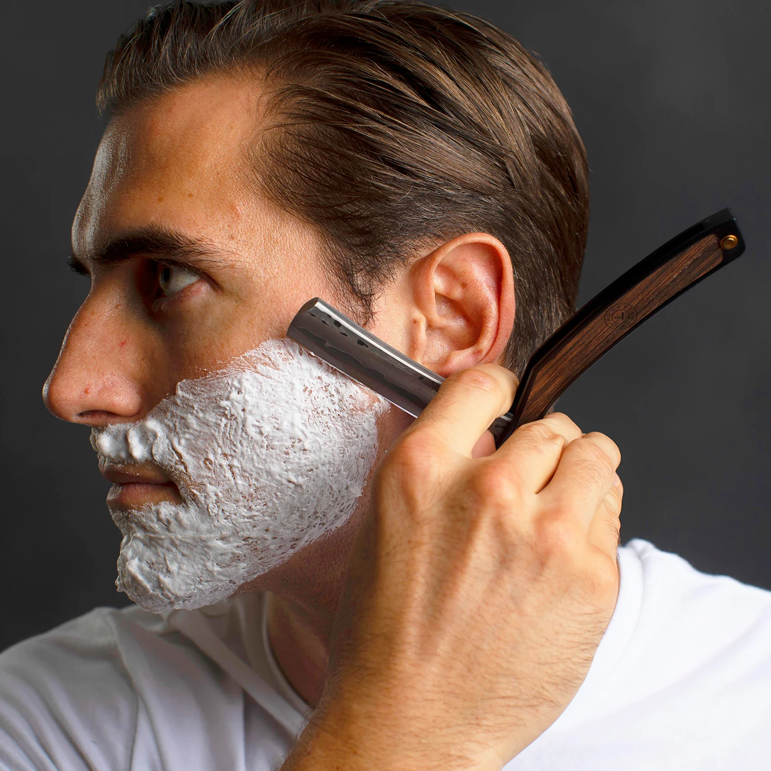 Kitchen knife edge being evaluated for hair-shaving sharpness