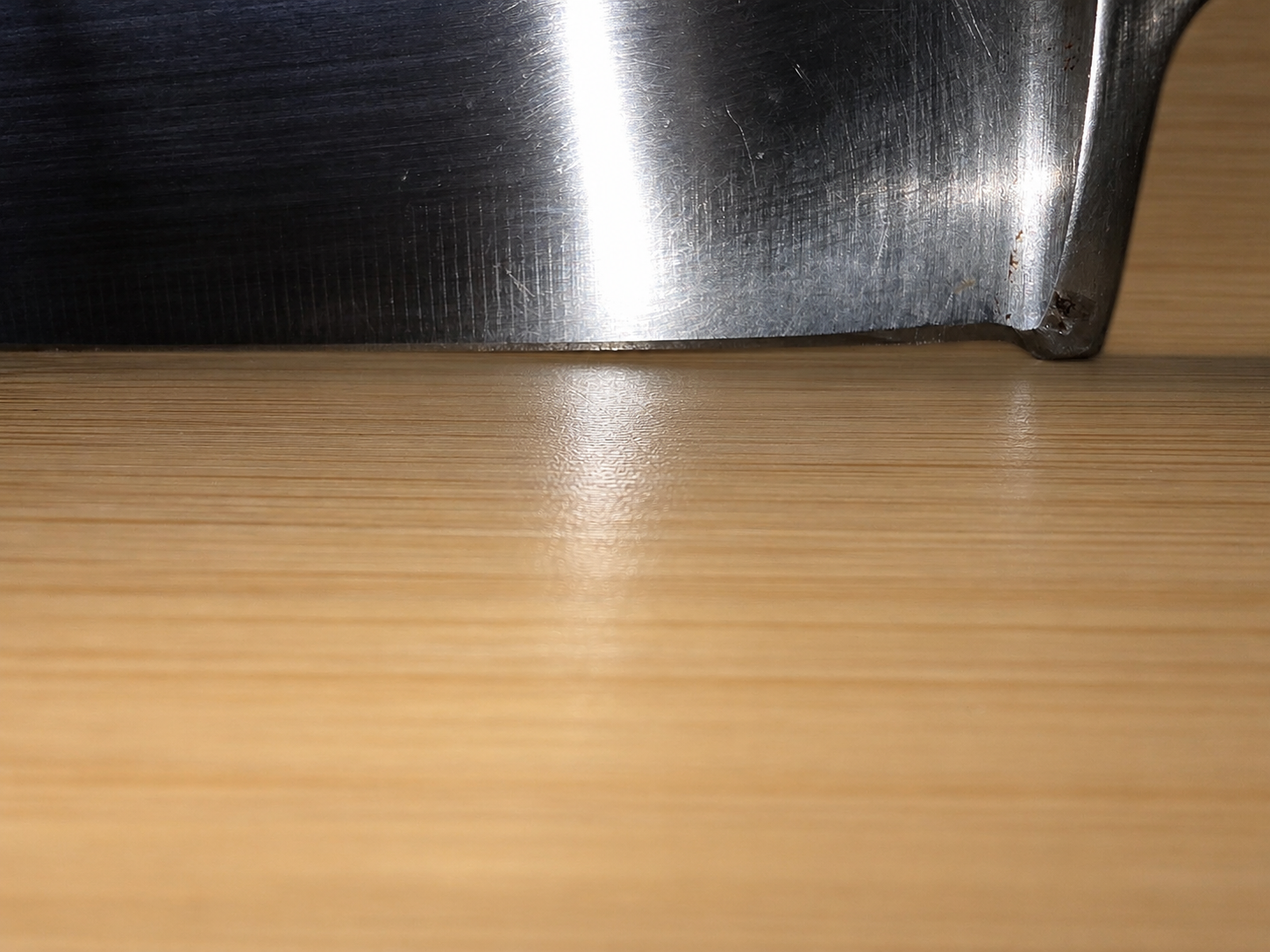 Edge-level view of knife heel before bolster repair
