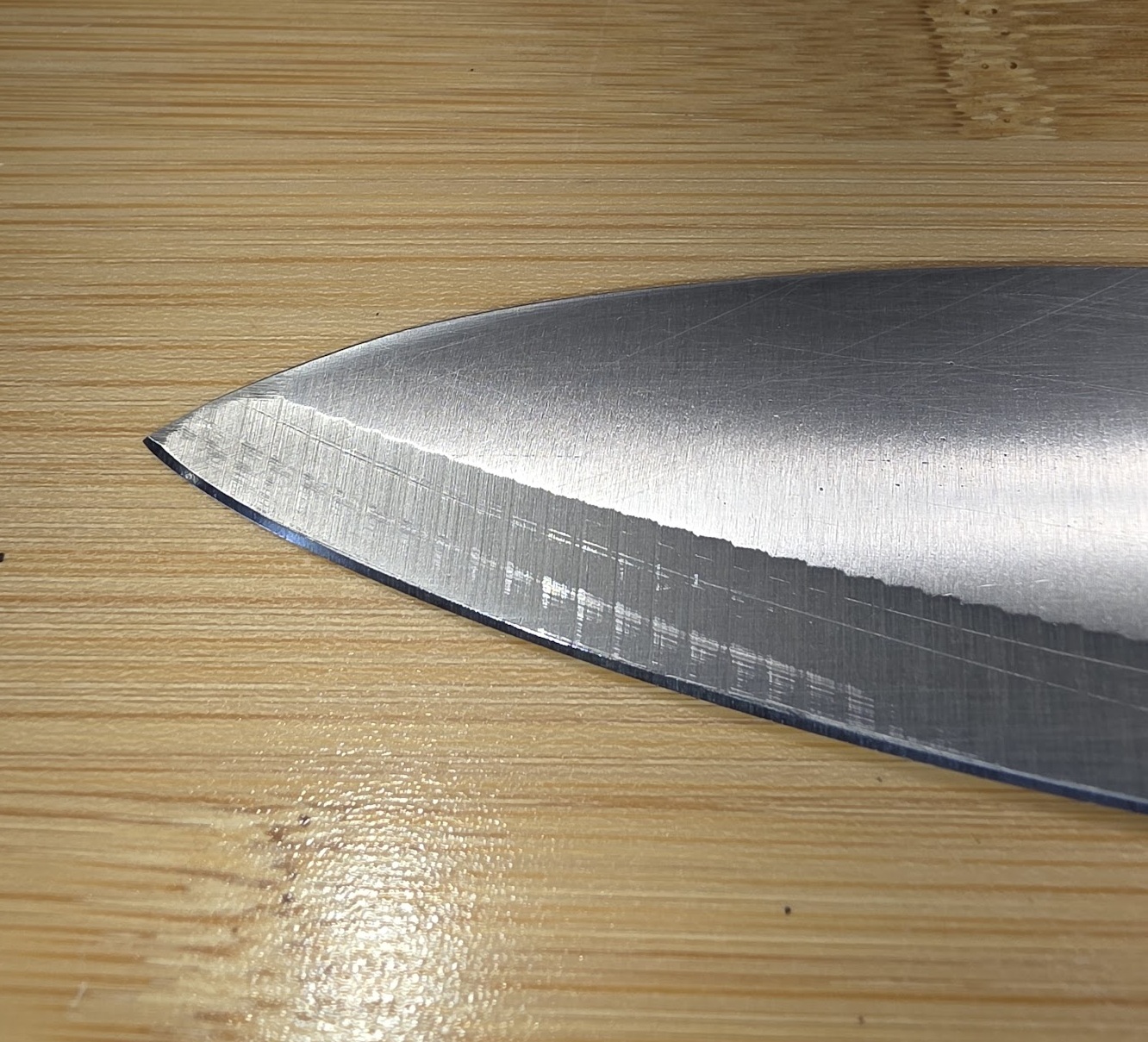 Kitchen knife after broken-tip repair and sharpening
